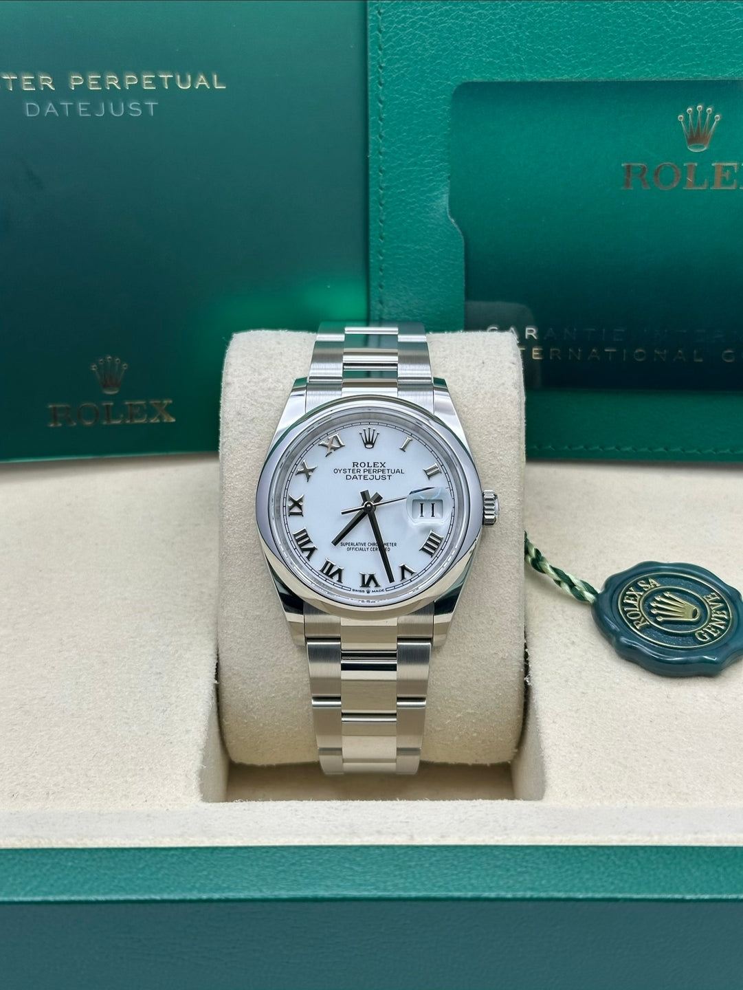 Rolex Datejust 126200 with white Roman dial and Oyster bracelet