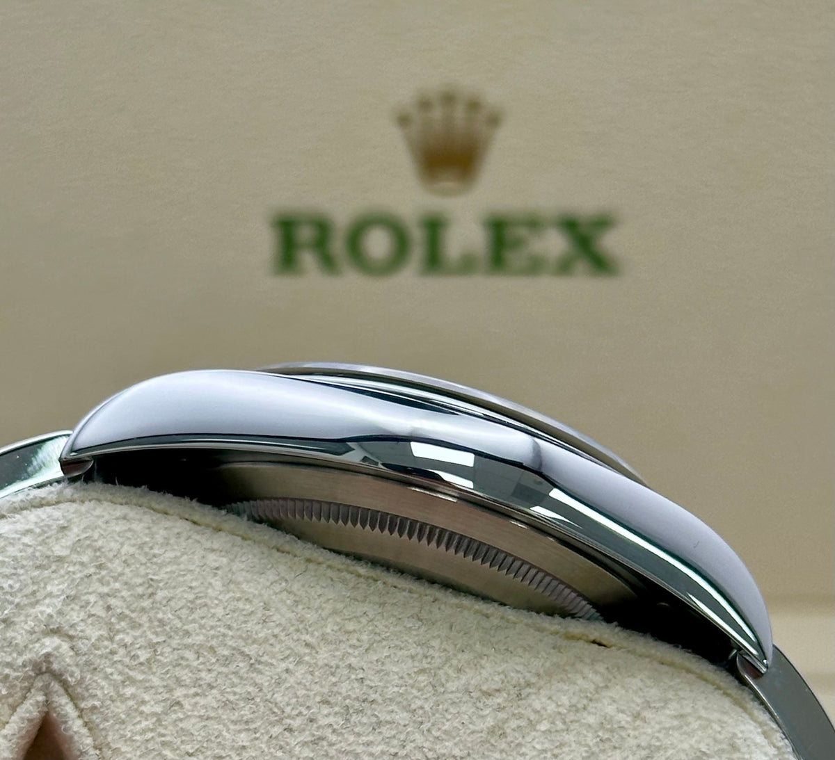 Rolex Oyster Perpetual 114300 with smooth domed bezel