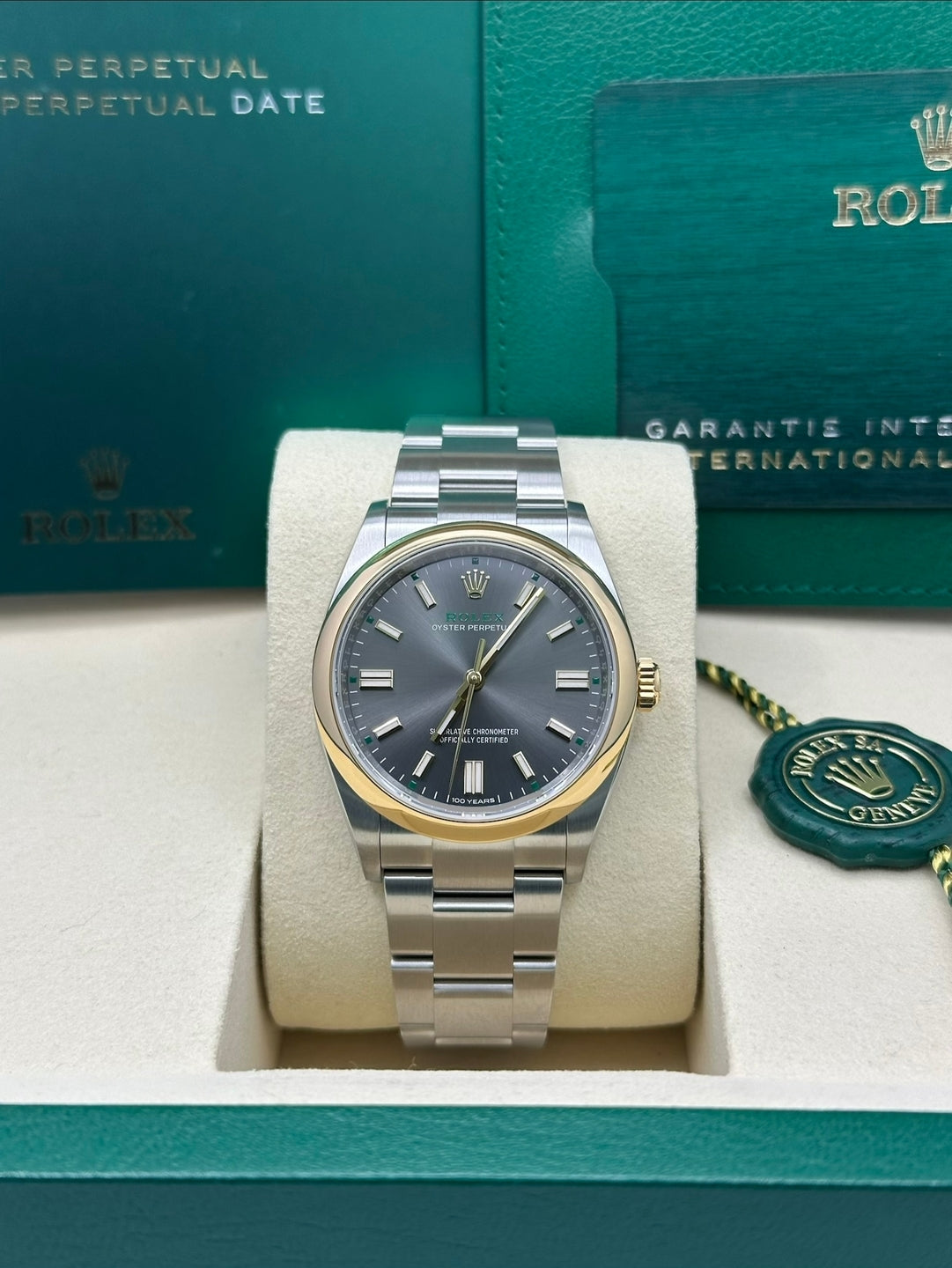 Rolex Oyster Perpetual 41 Rhodium Dial Gold Bezel Oyster Bracelet - 134303 - 2026